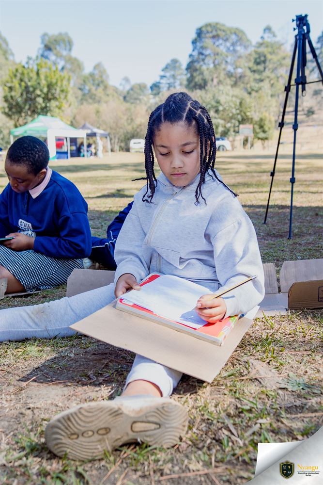 A young author concentrating on her writing