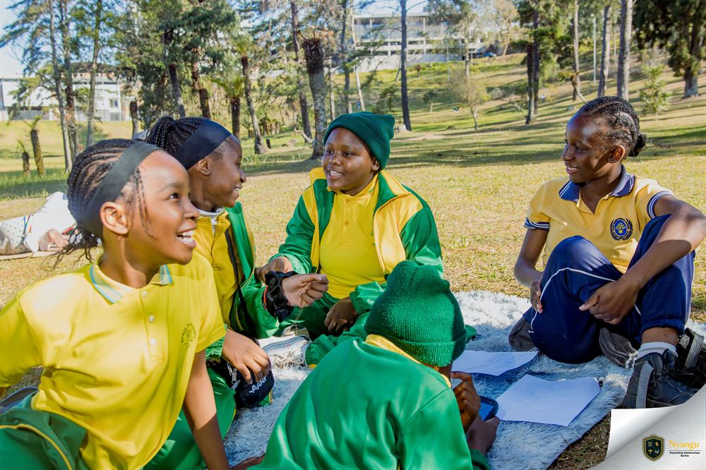 A group of young authors laughing together between sessions