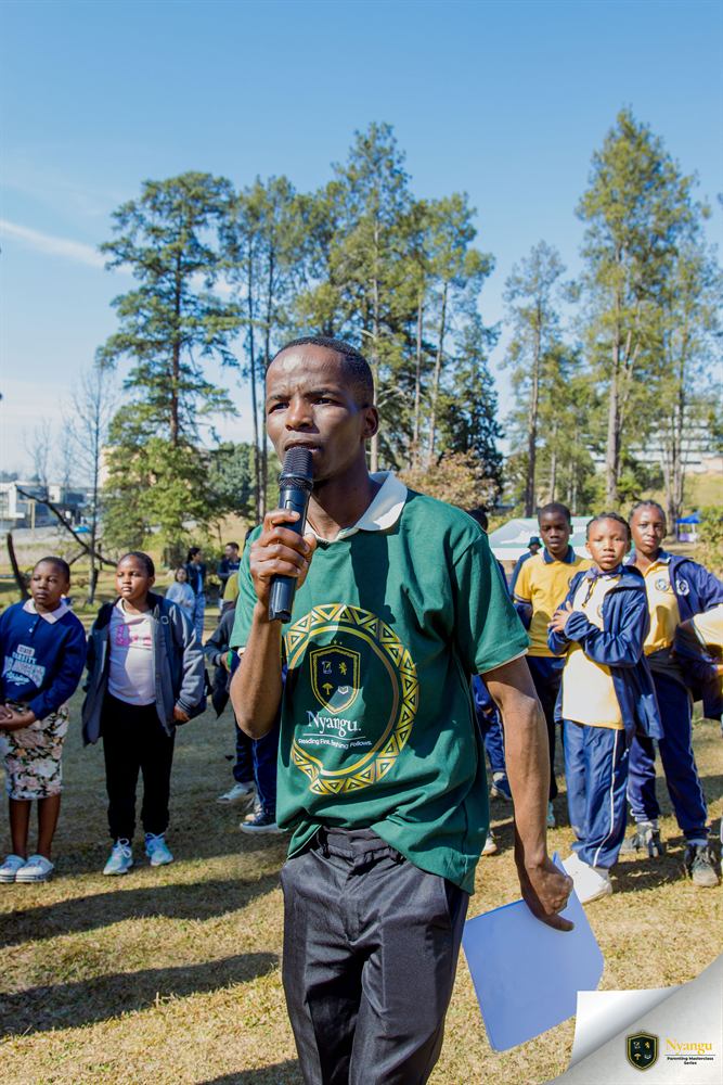 Addressing the festival grounds over the microphone